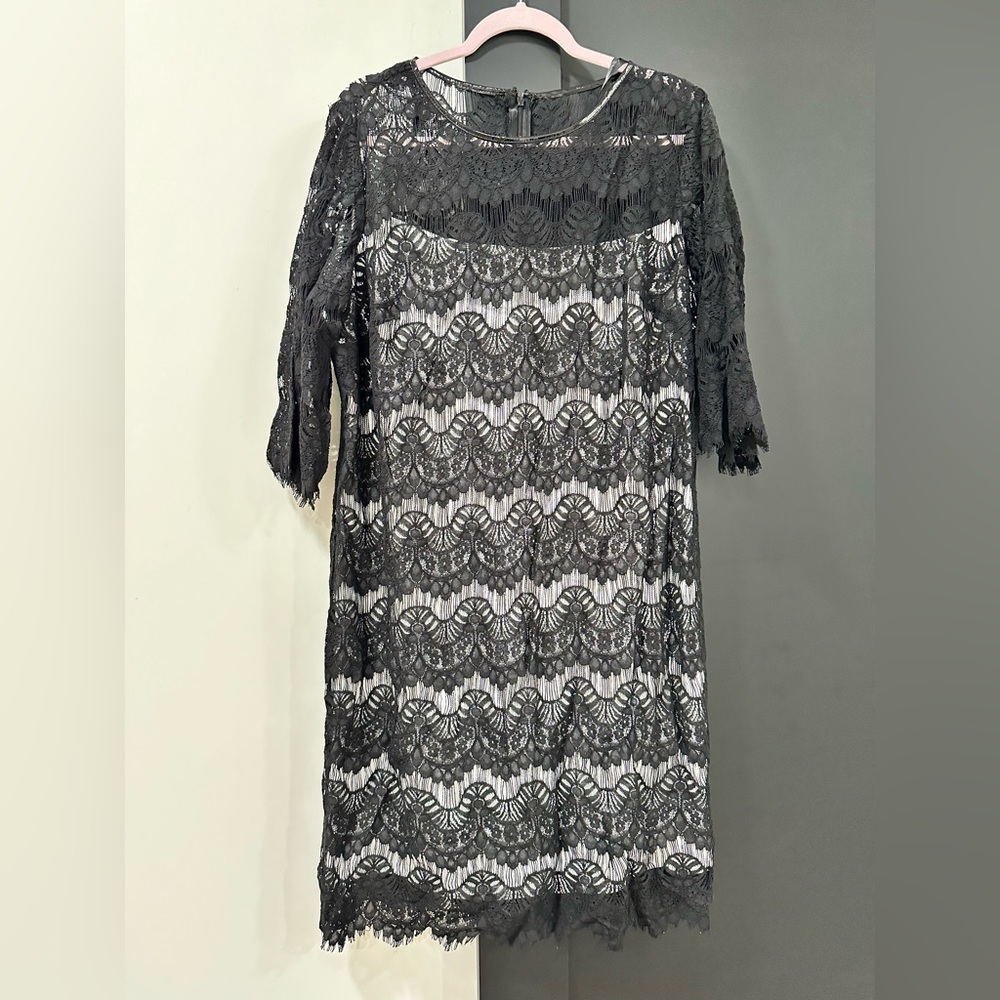 NWOT black lace over white Calvin Klein cocktail dress. Knee length, 3/4 sleeve